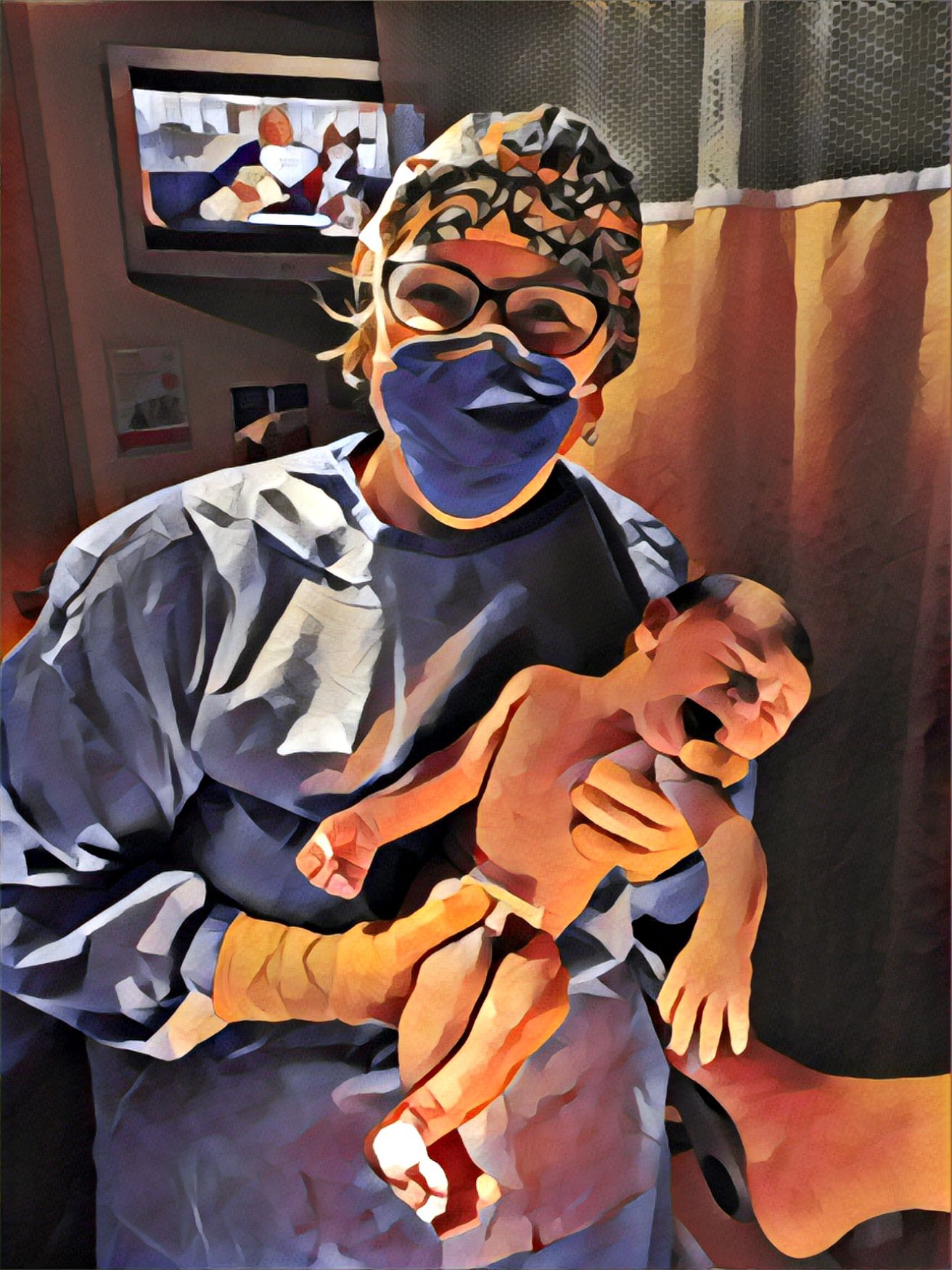 Healthcare worker in scrubs, face mask, and glasses holding a newborn baby in a clinical setting.